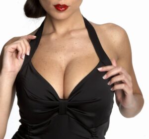 Sexy model with large breasts in black blouse | robert frank md